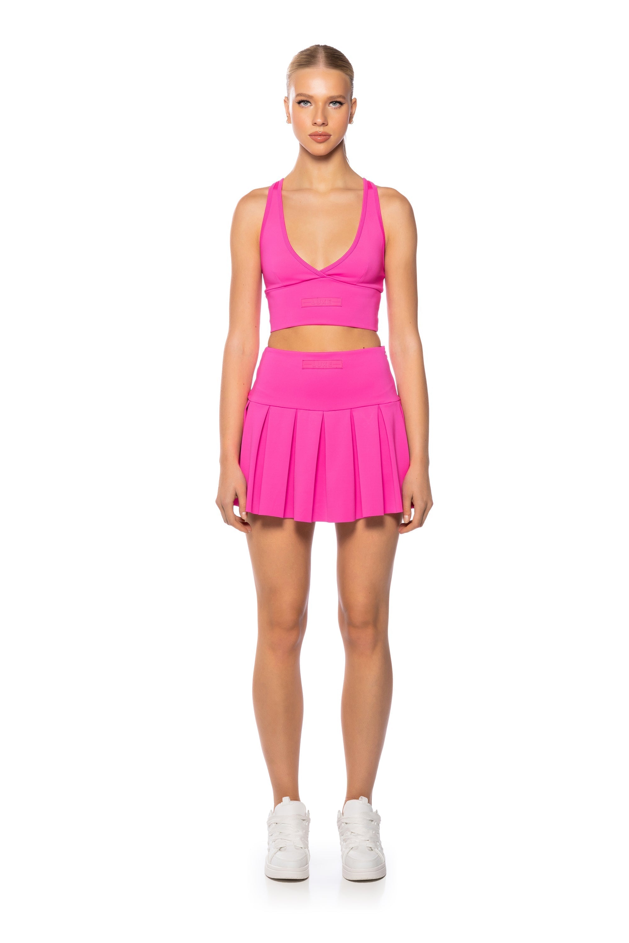 ITS THE PAXTON LUXE PLEATED SKORT IN NEON PINK