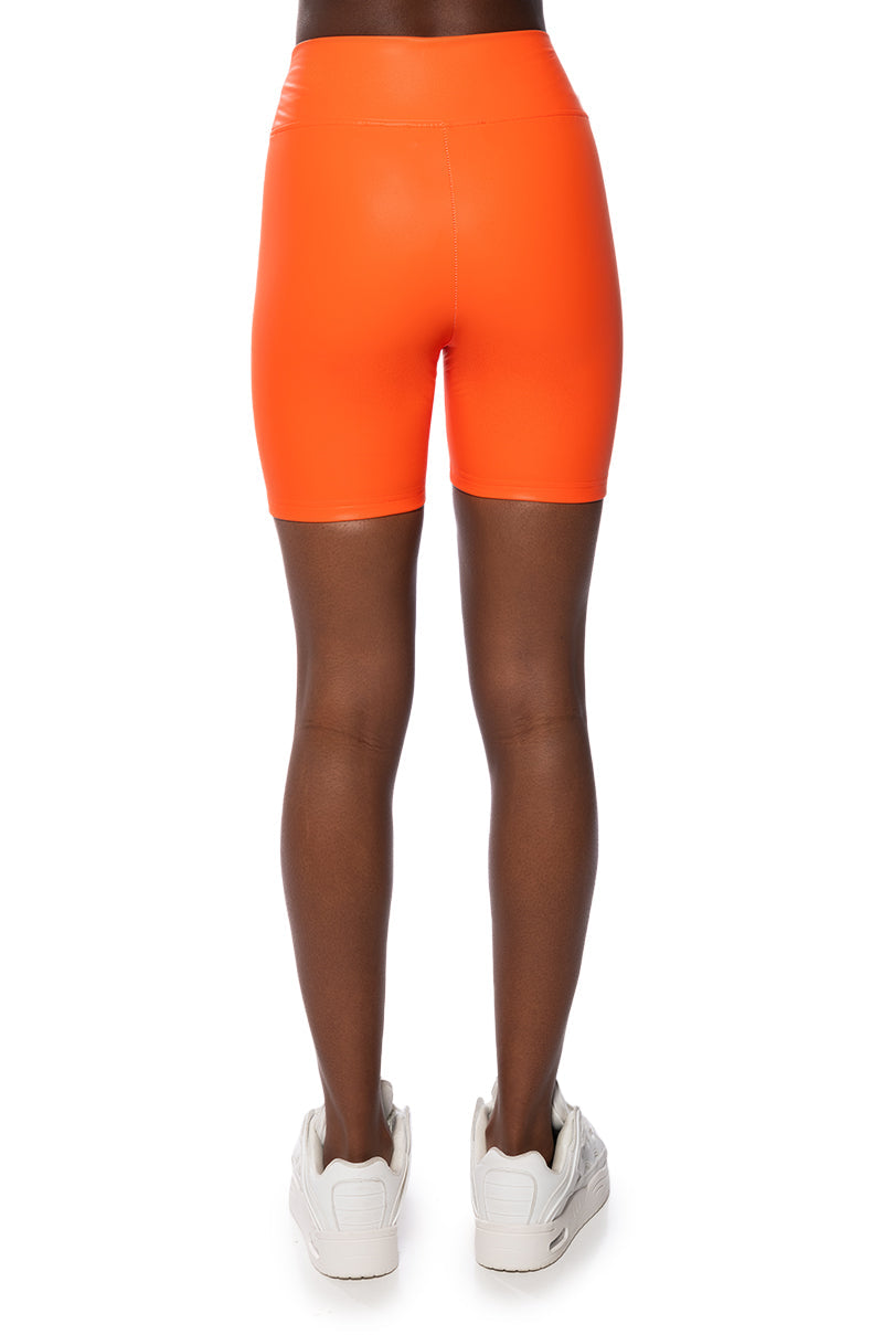 RIO FAUX LEATHER BIKER SHORT IN ORANGE